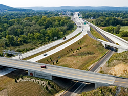 Photo of State Route 17 (future Interstate 86) with multi-level interchanges.