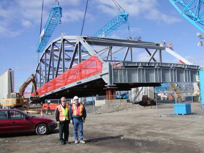 Federal Highway and ConnDOT engineer with truss in the background