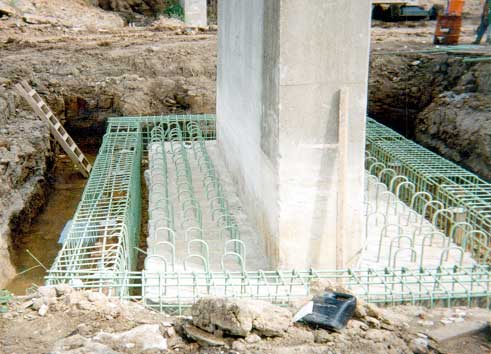 Image of dowels and reinforcement cages for retrofit of pier footing.
