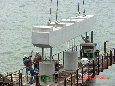 This is a photo showing the installation of a precast concrete pier cap.