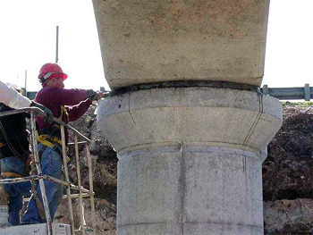This figure is a photo showing the grouting of the column cap connection using the dry pack method.