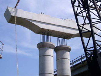 The figure shows a photo of the Lake Belton precast pier cap during installation.