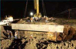 The first precast member, the west 'hide wall' is delivered shortly after midnight.