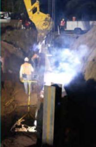 The hidewall is welded to the previously driven piles.