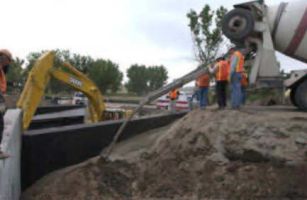 After both abutments were placed, the backface was lined with geofabric and flowfilled.