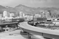 Photo of highway with city in the background
