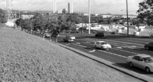 Cameo: Traffic approaches the suburbs on well marked pavement.