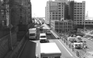 Cameo: A major artery transverses a busy commercial district.
