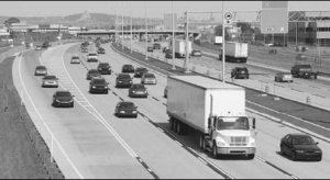Cameo: Moderate traffic on an urban stretch of highway.