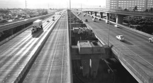 Cameo: Elevated urban expressway with collector/distributor lanes showing sparse traffic at off peak hours.