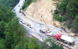 Photo showing construction of one of the bridge abutments on the steep slope.