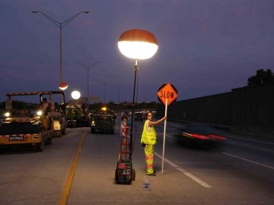 Example of ANSI Class 3 garment and lighted flagger station.