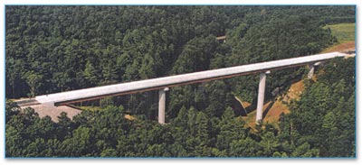 1999 State Route 52 Bridge over Clear Fork River after construction: Tennessee's second HPS bridge consists of four welded plate–girder spans that rise 200 feet above the river in a wooded Tennessee recreational area. The optimized use of HPS 70W in the girders kept weights to a minimum.