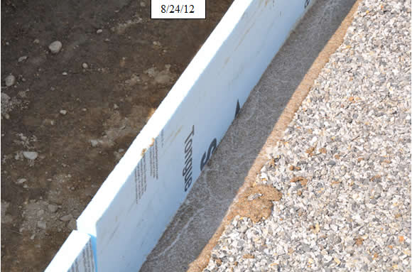 Figure 25. Photo. Install 1-inch foam backer board at bridge joint at each end of the deck to square up the end of the deck. Install epoxy grout in deck nosing at joints.