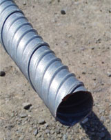 Photo shows the type of corrugated metal duct used to splice the two column segments in specimens SF-1 and SF-2.