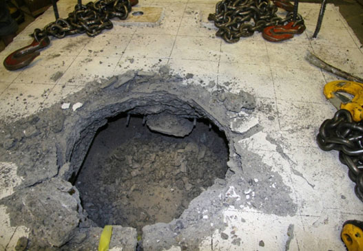 Photo shows footing damage after the column had been removed.