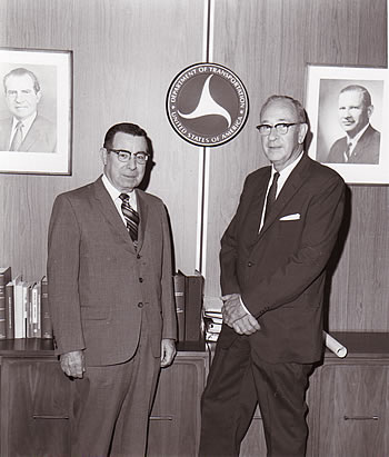 Administrator Francis C. Turner (left) poses with Emmett H. Karrer, the first Director of the National Highway Institute. (September 20, 1971).