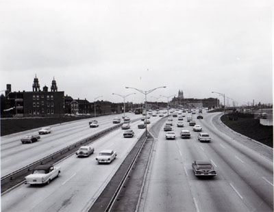 View of Northwest Expressway sowing a section of reversible roadway with 6 lanes of traffic.  Looking West from Augusta Blvd.  Chicago, Illinois. Photo by T.W. Kines 5-8-61