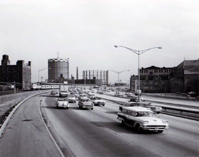 View of Northwest Expressway showing heavy traffic during peak period.  Looking East between Augusta Blvd.  And Division Street, C&NW RR on Left.  Chicago, Ill.  Photo by T. W. Kines 5-8-61