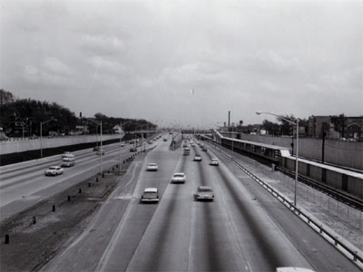 View of Congress Street Expressway ( Interstate 90) looking East from Lombard Street showing concrete retaining wall, exit and enter ramp from center of median and C.A.&E. RR.