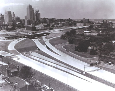 Missouri - The Kansas City central business district, looming in the distance above, is shown close up below, served by the Inner loop section of I-70.  (Construction was underway at the time of this photograph.)