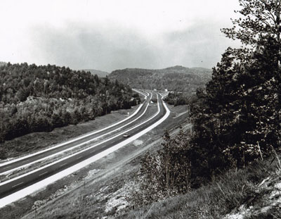 New York - A view along the 23-mile section of the Adirondack Northway (Interstate Route 87) which was adjudged America's Most Scenic New Highway of 1966 by Parade Magazine.  The section, between Lake George and Potterville in Warren County, is part of the 176-mile-long Albany-to-Canada Expressway.