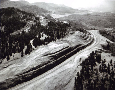Oregon - This is the southernmost section of Oregon's I-5 with the California State line just beyond the next hill.  Looking southerly along the split-level freeway.  At upper left, the old Pacific Highway U.S. 99 shows up at a former location. 