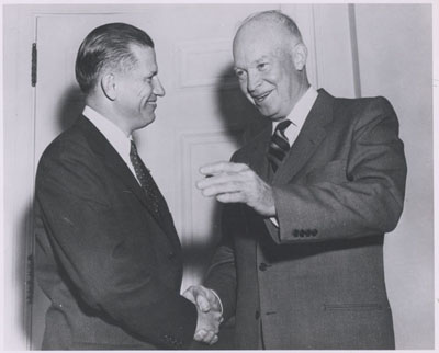 The first Federal Highway Administrator John A. Volpe with President Dwight D. Eisenwhower at the White House on October 22, 1956. 