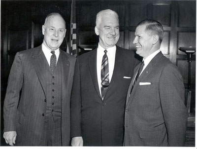 Secretary of Commerce Sinclair Weeks, Bertram Tallamy (who would become Federal Highway Administrator in February 1957) and Mr. John Volpe on the occasion of Mr. Volpe's swearing in as first Administrator, October 22, 1956.