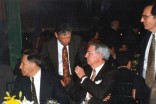 Former Federal Highway Administrator Robert E. Farris (seated) talks with (unknown).