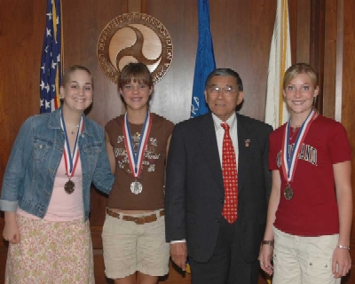 On June 17, Secretary of Transportation Norman Y. Mineta congratulated Silver Medalists Tatum Holland, Justine Rice, and Brittany Rice (left to right) for their success in the National History Competition.