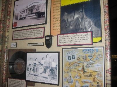 The lower portion of the panel includes a Route 66 map and a photo of Nat King Cole and the King Cole Trio, whose recording of "Route 66" in 1946 was the first hit version of the song.  The panel also shows how musicians from Arkansas, Oklahoma, and Texas traveling Route 66 to California helped establish the "Bakersfield Sound," still an important influence on country music today.
