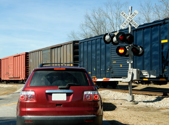 Photo of car at railroad crossing