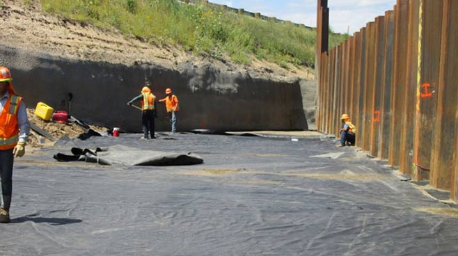Crews place geosynthetic fabric on the I-70 GRS-IBS project in Colorado.