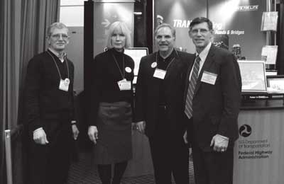 J. Richard Capka (far right), then-Federal Highway Administrator, stopped by the Highways for LIFE booth at the Transportation Research Board Annual Meeting in Washington, D.C., in January to talk with (left to right) Charles Churilla, HfL consultant; Kathleen Bergeron, HfL program coordinator; and Gary Hoffman, HfL consultant. Capka resigned in February after more than five years of service with FHWA.