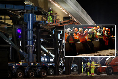Crews used SPMTs to move the Sam White  Bridge into place over I-15 in Utah in just five hours. (Inset)Transportation  professionals watched the overnight bridge move and attended a workshop the  next day to learn how it was done.
