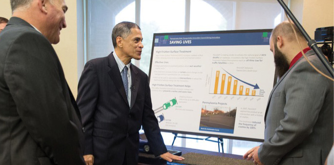 Federal Highway Administrator Gregory Nadeau (left) and U.S. Transportation Deputy Secretary Victor Mendez (center) view exhibits at the Pennsylvania Innovation Showcase.