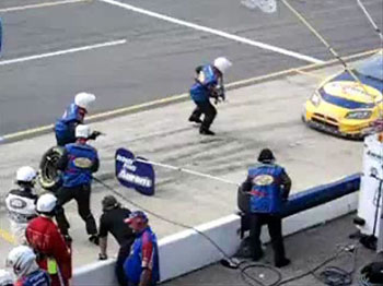Photo of pit crew at a racetrack