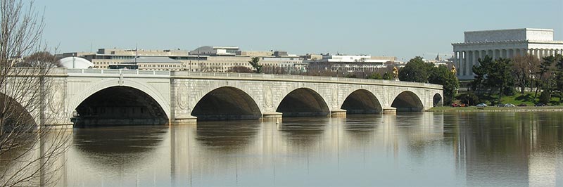 This slide shows an image of the Arlington Memorial Bridge. The bridge spans the Potomac River and has seven visible arches. The Lincoln Memorial is to the right of the bridge and other buildings, trees, and vegetation, can be seen behind the bridge. There is text above the image of the bridge. There are nine smaller images of various roadways and bridges, including the Natchez Trace Parkway Bridge, beneath the image of Memorial Bridge, with the words “Eastern Federal Lands” overtop of the nine images. The slide number is visible in the lower right corner.