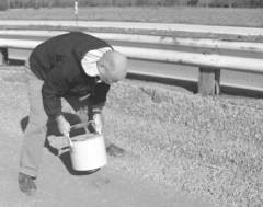 photo of person using density gage to check pavement density