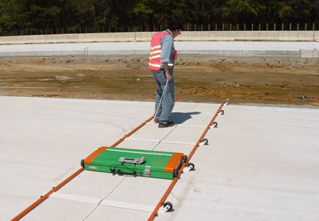 A worker pulls the MIT Scan-2 along the joint being scanned.
