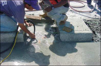 Figure 17. Workers cleaned the holes to eliminate any debris