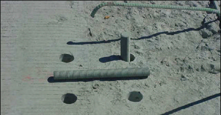 Figure 18 . The anchor bolts were placed in the holes already drilled