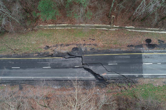 Damage to the southbound lane of US 231 following the February 2020 rainfall event. Roadway with large cracks and movement of the pavement.
