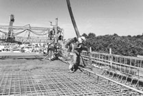 Concrete being poured for a bridge deck
