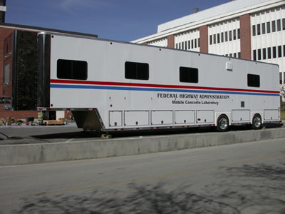 Figure 6. Photo. FHWA Mobile Concrete Laboratory. An exterior view of FHWA's Mobile Concrete Laboratory, which is housed in a 15-m (50-ft) trailer.