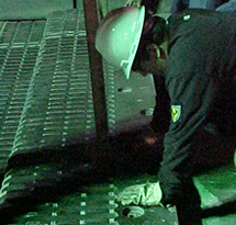 Figure 2. Photo. A worker installs a new finger joint section on the Inner Harbor Canal Bridge in New Orleans, LA.