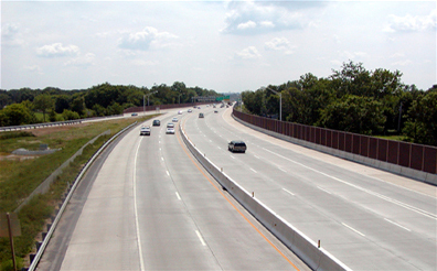 Figure 3. Photo. A view of a highway with traffic traveling on it.