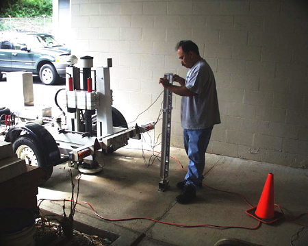 A Falling Weight Deflectometer (FWD) is calibrated in Hawaii.