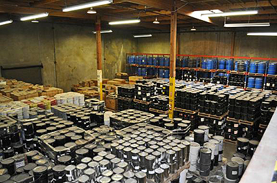 An elevated view looking down at drums and other containers of pavement materials stored in the LTPP program's Materials Reference Library. The library is located in Reno, NV.